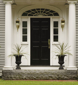A formal entry look with container gardens.