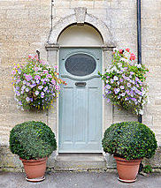 Container gardens impact your front entrance.